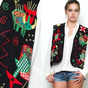 May include: Black vest with colourful embroidered animals and geometric patterns. The vest has a red, green, yellow and blue colour scheme.