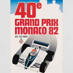 May include: A vintage poster for the 40e Grand Prix Monaco 82, featuring a white and blue race car with the number 1 on the hood. The text reads 40e GRAND PRIX MONACO 82 and 20/23 MAI, with a silhouette of a castle in the background and a small crest.