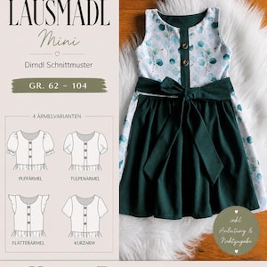Op de afbeelding: Een groen en witte dirndl jurk met een strik, met een bloemenpatroon op het lijfje. De afbeelding toont ook een patroon met verschillende mouwvarianten en de tekst "LAUSMADL Mini".