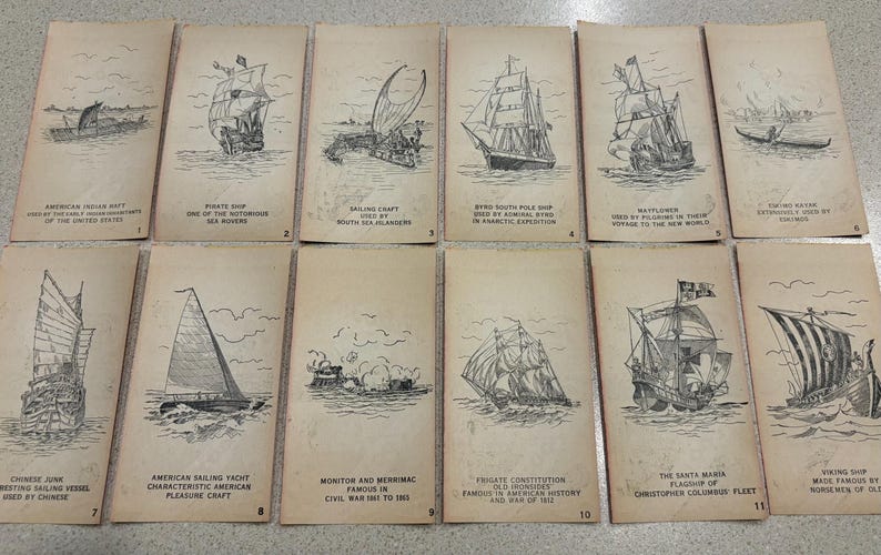 May include: A collection of vintage cards featuring detailed black and white illustrations of various sailing ships. Each card has a title describing the ship's type and origin, such as "Pirate Ship" and "Viking Ship."