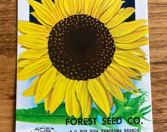 May include: A vintage seed packet for Giant Russian sunflowers. The packet features a large, detailed illustration of a sunflower with yellow petals and a dark brown center. Text includes "SUNFLOWER", "FOREST SEED CO.", and other details.
