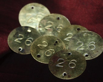 Lot of 7 Round Antique Brass Numbered Tags, stamped #26