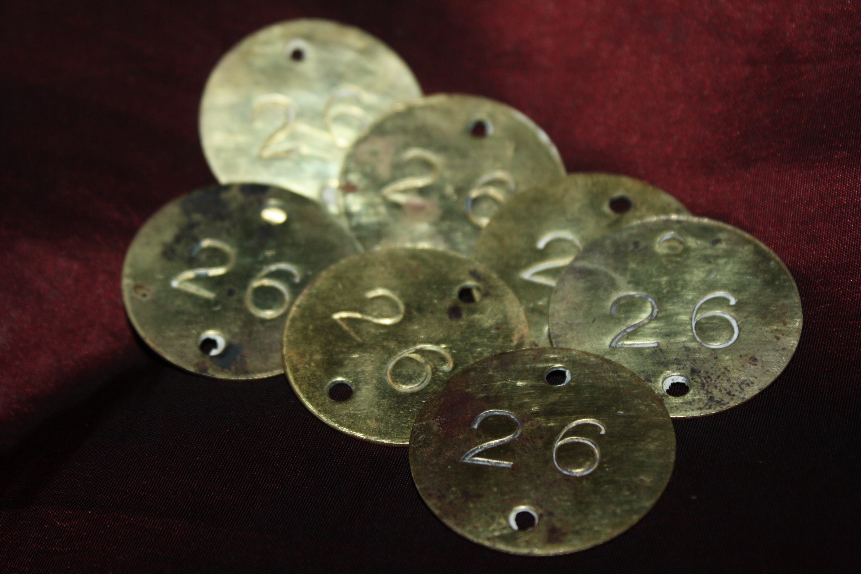 Lot of 7 Round Antique Brass Numbered Tags, stamped #26