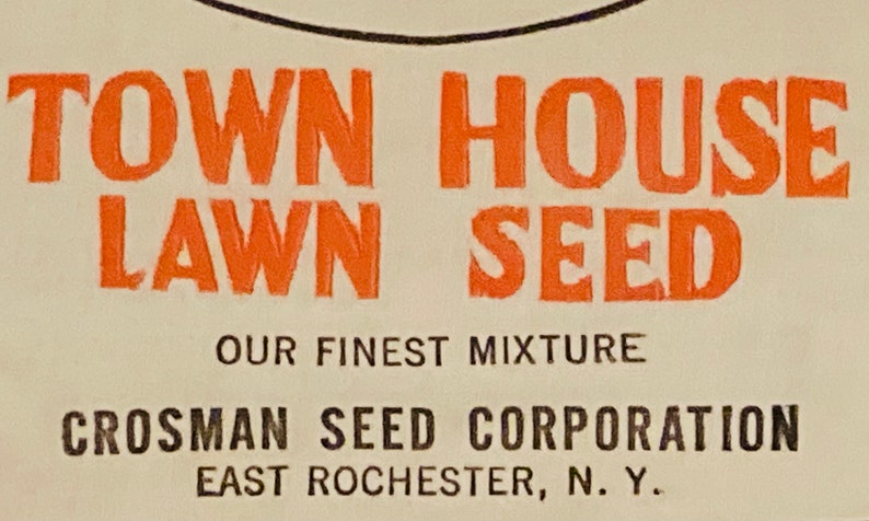 May include: Orange and black text on a white background reads "Town House Lawn Seed Our Finest Mixture Crosman Seed Corporation East Rochester, N.Y."