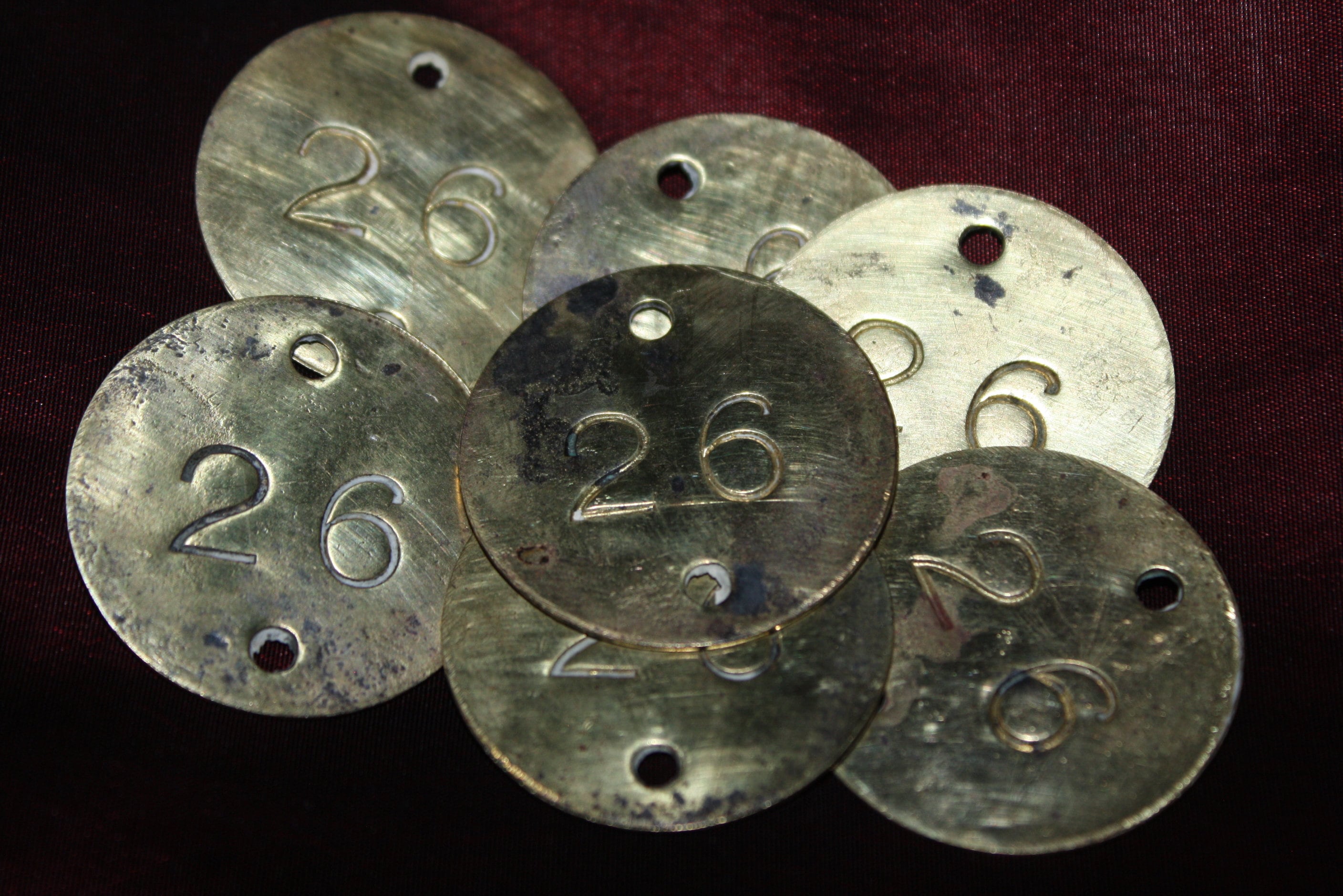 Lot of 7 Round Antique Brass Numbered Tags, stamped #26