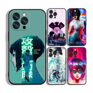 May include: A collection of phone cases featuring artwork from the anime series "Ghost in the Shell." The cases display various character illustrations and the series title in English and Japanese. The cases are in shades of green, purple, and pink.