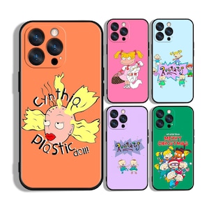 May include: A collection of phone cases featuring cartoon character designs. The cases are in various colors, including orange, pink, purple, and green. Some cases have the text "Cynthia Plastic Doll!" and "Rugrats". Other cases have cartoon character graphics.