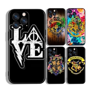 May include: Black phone cases with various designs. One case features the word "LOVE" with a lightning bolt and a symbol. Other cases display the Hogwarts crest and other related graphics. The cases are designed for a smartphone.