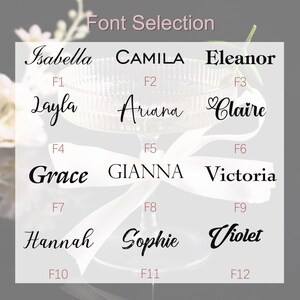 May include: A selection of twelve font styles for personalized items, displayed over a champagne glass. The fonts include Isabella, Camila, Eleanor, Layla, Ariana, Claire, Grace, Gianna, Victoria, Hannah, Sophie, and Violet.