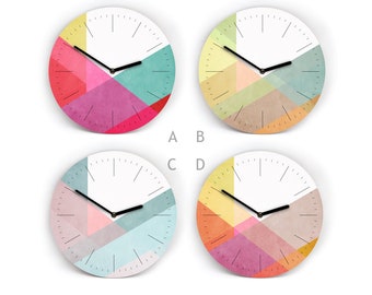 Colorful wall clock with lines - Overlay design - 4 patterns to choose from - 3 sizes - From mini to large - Easy to read - Quiet movement