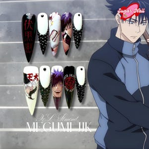 May include: A set of ten long, pointed acrylic nails with anime-inspired designs. The nails feature black, white, and colorful artwork, including characters and Japanese text. Some nails have black gem accents at the base. The image also includes the text "Sugar Nail" and "MEGUMI JJK".