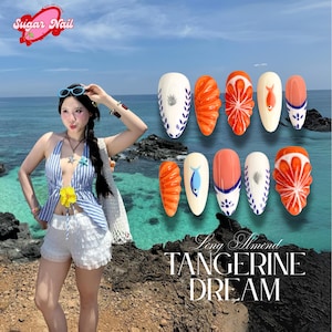 May include: A set of almond-shaped artificial nails with a "Tangerine Dream" design. The nails feature orange, white, and blue accents, with fruit and fish motifs. The Sugar Nail logo is in the upper left corner.