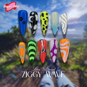 May include: Ten long almond-shaped artificial nails with diverse designs. The nails display colours such as blue, black, yellow, green, red, purple, and orange, with patterns including dots, stripes, and abstract shapes. The text "Sugar Nail" and "ZIGGY WAVE" are visible.