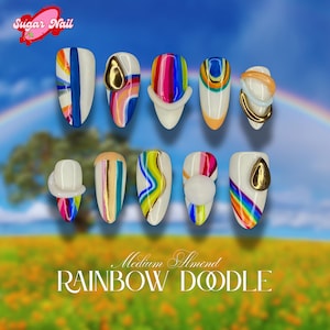 May include: A set of ten medium almond-shaped artificial nails with colorful rainbow designs. Some nails feature gold accents, while others have 3D elements. The text "Sugar Nail" and "RAINBOW DOODLE" are visible.