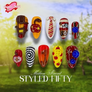 May include: A collection of ten medium almond-shaped nail designs. The designs include a chocolate bar, an apple, a tie, a "MR 50" design, and other unique patterns. The text "Sugar Nail" and "STYLED FIFTY" are also visible.