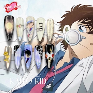 May include: A collection of custom nail art designs. The nails feature various designs, including anime-inspired characters, gold accents, and intricate patterns. The color palette includes black, white, gold, and shades of blue and purple. The text "Sugar Nail" is visible.