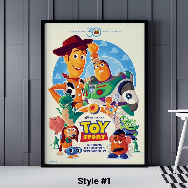 May include: A framed "Toy Story" movie poster featuring Woody and Buzz Lightyear, with other characters like Rex, Hamm, and Mr. Potato Head. The poster reads "Returns to Theatres September 12" and "Celebrating 30 Years & Beyond."