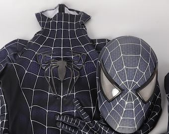 May include: Black and grey Spider-Man costume with a black web design and a matching mask. The mask has a black web design and a grey spider logo.
