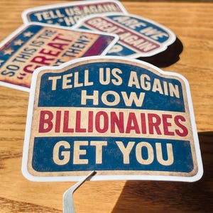 May include: A collection of stickers with vintage-style designs and text. The main sticker reads "TELL US AGAIN HOW BILLIONAIRES GET YOU" in red and white on a blue background. Other stickers have similar slogans.