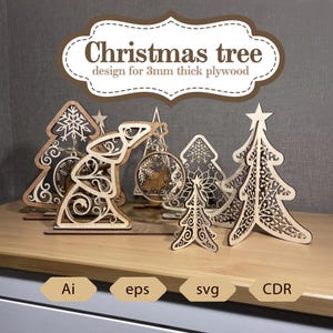 Può includere: Design di alberi di Natale in legno per compensato di 3 mm di spessore. L'immagine mostra diversi ornamenti e decorazioni natalizie tagliati al laser, tra cui alberi, una renna e un fiocco di neve. Il testo nell'immagine dice "Christmas tree design for 3mm thick plywood".