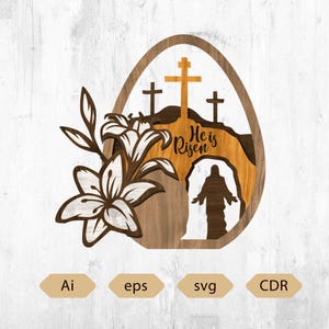 May include: Wooden Easter egg decoration with a layered design. Features a cross, the text "He is Risen", and a silhouette of a figure. Includes lily flowers and leaves. The design is in shades of brown, white, and gold.