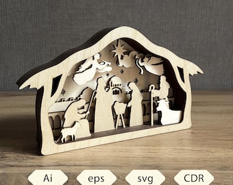 May include: A wooden nativity scene with a layered design. The scene depicts figures, angels, and stars within a house-shaped frame. The base has the text "Ai, eps, svg, CDR".
