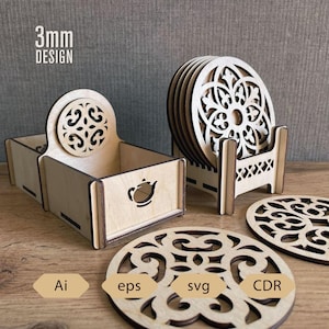 May include: Wooden coaster set with a decorative floral design. The set includes a holder and a box with a teapot cutout. The text "3mm DESIGN" is visible. Also included are the file types: Ai, eps, svg, and CDR.