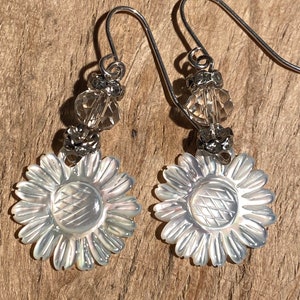 Carved mother of pearl sunflower with rhinestones and clear crystal beads on sterling silver hooks