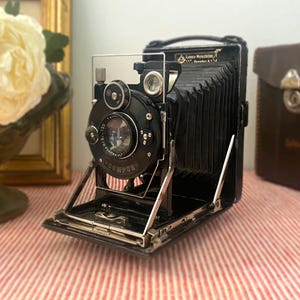 Appareil photo ancien vers 1920-1930, appareil photo pliant en cadeau pour collectionneurs, Compur Dresden, avec déclencheur et étui en cuir, cadeau de fête des pères