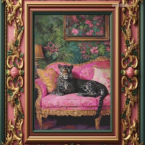 May include: An ornate framed picture of a leopard on a pink sofa, set against a floral backdrop. The frame is gold and green with pink detailing. A smaller framed picture hangs above the sofa in the artwork.
