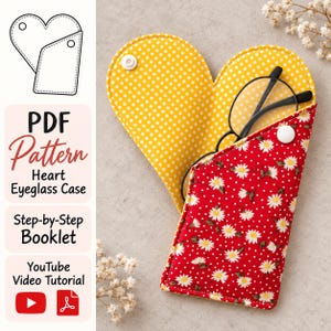 May include: A heart-shaped fabric spectacle case featuring a red exterior with a white daisy print and a yellow interior with white polka dots. The case includes a white snap closure and contains black-framed spectacles inside.