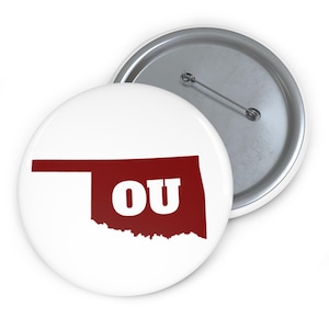 Botón con el esquema de la Universidad de Oklahoma State / Espíritu escolar