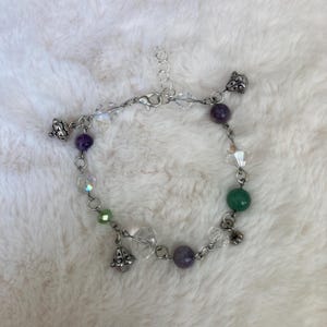 Floral purple and green charm bracelet