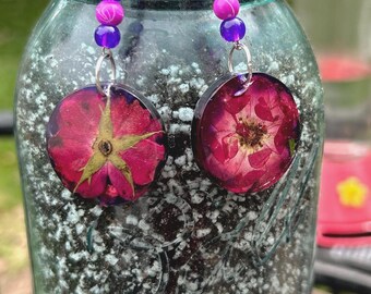 Red Carpet. Such uch a vibrant pop of color and unique design, add extra intrigue.  People will notice them. Hypoallergenic ear wires.