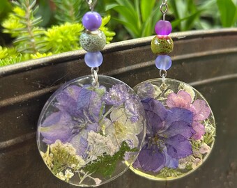 Strong. These dangle earrings show your unique style. Real pressed flowers and fun beads topped with hypoallergenic ear wires.