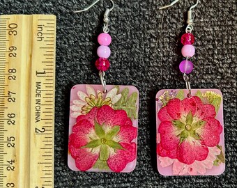 Natural Beauty, Gorgeous statement earrings made with real pressed plants encased in beautiful pink resin. Sure to be a crowd-pleaser!