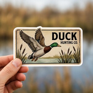 Detailed view of the 9 Rustic Hunting & Fishing Stickers, focusing on the high-quality print and waterproof finish. This vintage wildlife sticker pack is designed to withstand outdoor use on gear like coolers and tackle boxes. The stickers feature intricate designs that make them a premium gift for hunter or fishing enthusiasts.