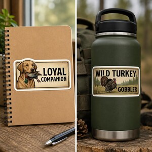 A split image showcasing the 9 Rustic Hunting & Fishing Stickers in use. On the left, a LOYAL COMPANION dog sticker is on a brown spiral notebook. On the right, a WILD TURKEY GOBBLER sticker is on a dark green water bottle. These vinyl decal set items are perfect for decorating journals and tumblers with a vintage wildlife aesthetic.