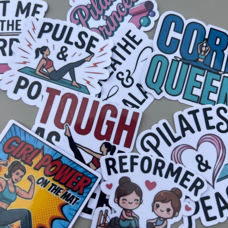 Various Pilates stickers scattered on a flat surface, showcasing funny reformer stickers in a playful arrangement. These die cut vinyl decals are ideal for personalizing a water bottle sticker collection or adding flair to a laptop with unique fitness-themed artwork.