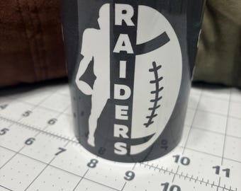 Tazza da caffè con scritta "Raiders Football"