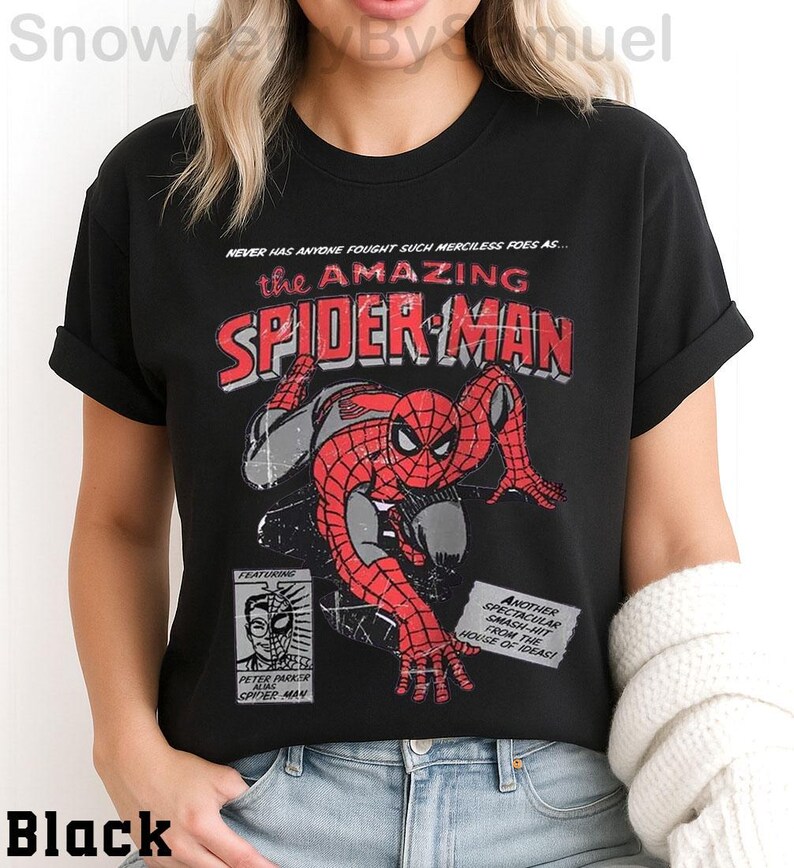 a woman wearing a black spider - man t - shirt