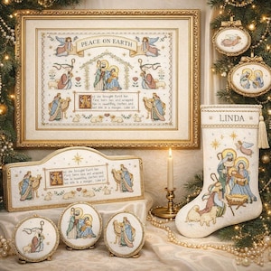 May include: A collection of Christmas-themed cross-stitch items, including a framed picture, a decorative sign, ornaments, and a stocking. The framed piece reads "Peace on Earth." The stocking is personalized with the name "Linda."