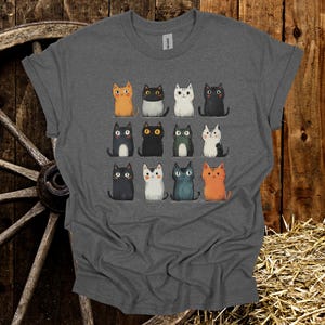 Whimsical Cartoon Cat T-Shirt – Cute Hand-Drawn Kitties Graphic Tee, Funny Cat Lover Gift, Vintage Style Feline Shirt, Unisex Soft Tee.
