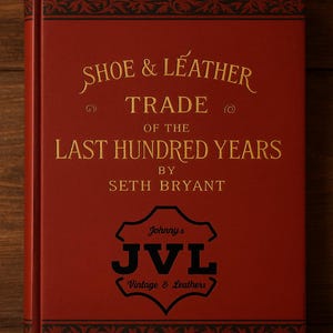 Op de afbeelding: Een rood boek met gouden letters en zwarte bloemmotieven. De titel luidt "SHOE & LEATHER TRADE OF THE LAST HUNDRED YEARS" door Seth Bryant. Het boek bevat ook het logo van "Johnny's JVL Vintage & Leathers."