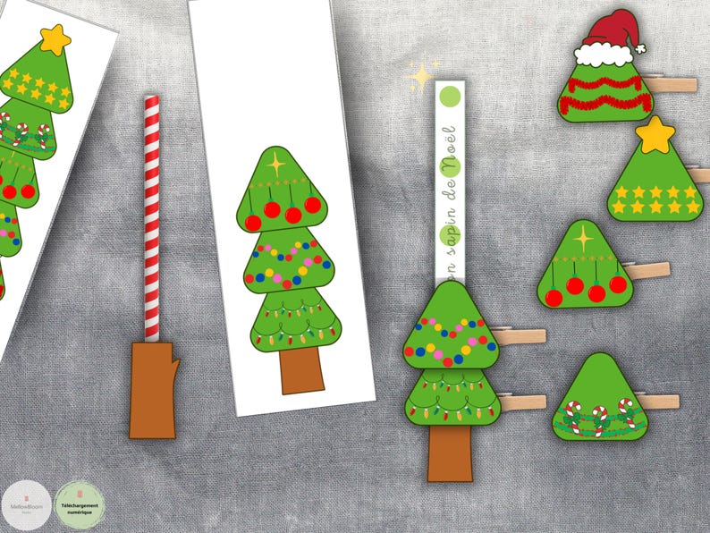 May include: A collection of Christmas-themed paper cutouts and decorations. The image features green Christmas trees with various ornaments, a red and white striped straw, and the text "en sapin de No&euml;l".