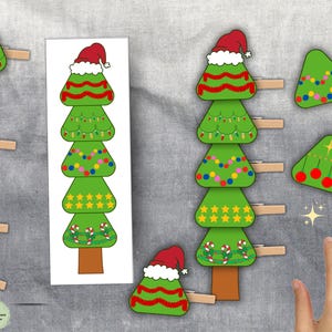 May include: Green Christmas tree-shaped decorations with various festive designs, including lights, stars, and candy canes. Some are attached to wooden clothespins. A vertical image of a Christmas tree is also present.
