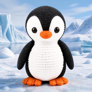 Peut inclure: Un pingouin en crochet fait à la main, avec une tête et des ailes noires, un ventre blanc et un bec et des pieds orange. Le pingouin se tient sur une surface enneigée avec un paysage glacé en arrière-plan. Le pingouin a de grands yeux noirs.