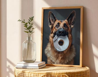 May include: A framed print featuring a German Shepherd dog holding a roll of white tape in its mouth. The dog has brown and black fur and is set against a dark background. The frame is made of light brown wood.