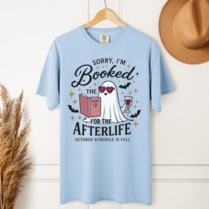 Halloween Book Shirt, Sorry I'm Booked for the Afterlife, Ghost Book Lover Tee, Fall Reading Shirt
👻 SORRY, I'M BOOKED FOR THE AFTERLIFE

For the reader whose October schedule is already completely full.