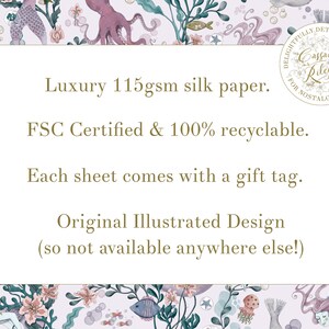 A white rectangle with gold text on a background of a watercolour illustration of sea creatures. The text reads: "Luxury 115gsm silk paper. FSC Certified & 100% recyclable. Each sheet comes with a gift tag. Original Illustrated Design (so not available anywhere else!)"